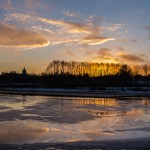 Solnedgång över sjöparkens is